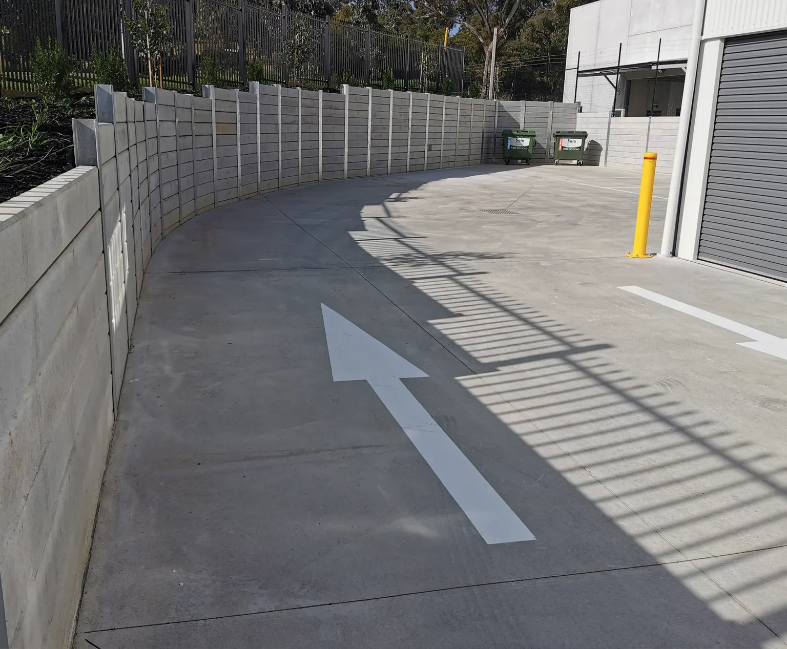 The Marina Smooth Concrete Sleeper in Plain Grey Used on an Industrial Factories Retaining Wall Project and Supplied by Sunset Sleepers