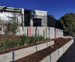 The Marina Smooth Face Concrete Sleeper in Plain Grey Used for a School Retaining Wall Project and Supplied by Sunset Sleepers