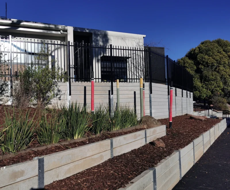The Marina Smooth Face Concrete Sleeper in Plain Grey Used for a School Retaining Wall Project and Supplied by Sunset Sleepers