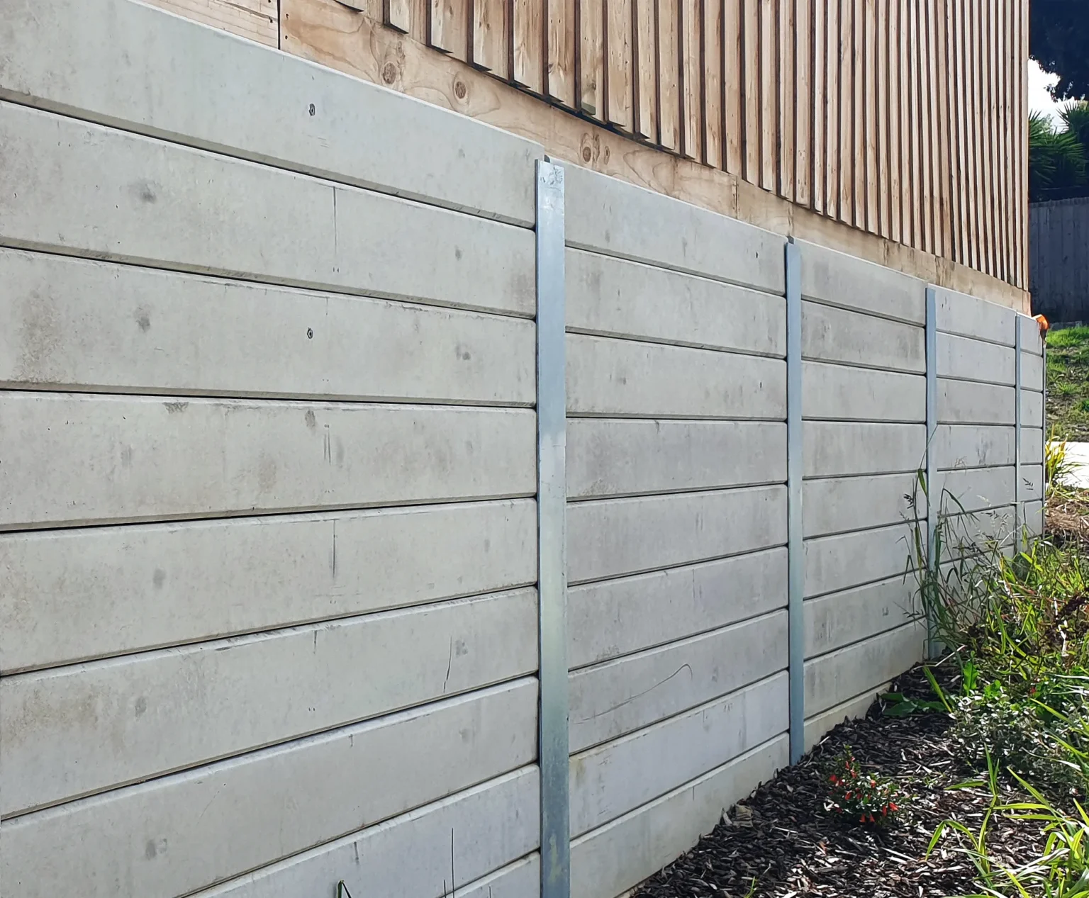 Timber Fence Application Use for Retaining Wall Project Using the The Marina Smooth Concrete Sleepers in Plain Grey and and Supplied by Sunset Sleepers