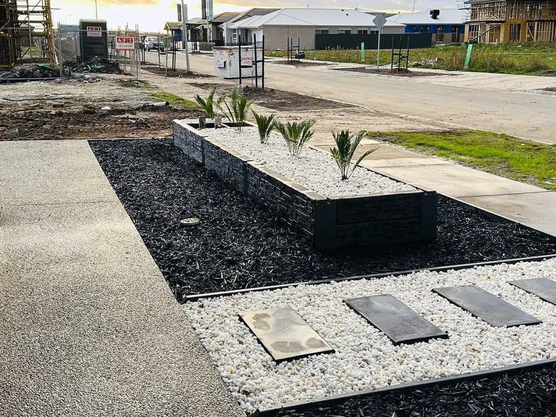 Newly Constructed Small DIY Garden Bed in Front Yard Using The Manhattan Charcoal Stacked Stone Concrete Sleeper and Finished off with Auseal EC25 Bluestone Charcoal Sealer