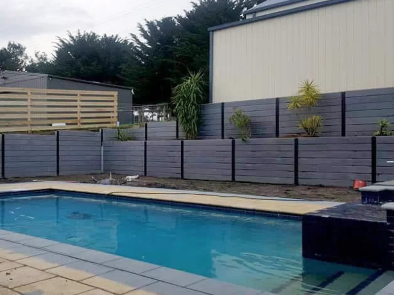 Retaining Wall Project Surrounding Pool Area Using The Charcoal Marina Smooth Concrete Sleepers and Supplied by Sunset Sleepers